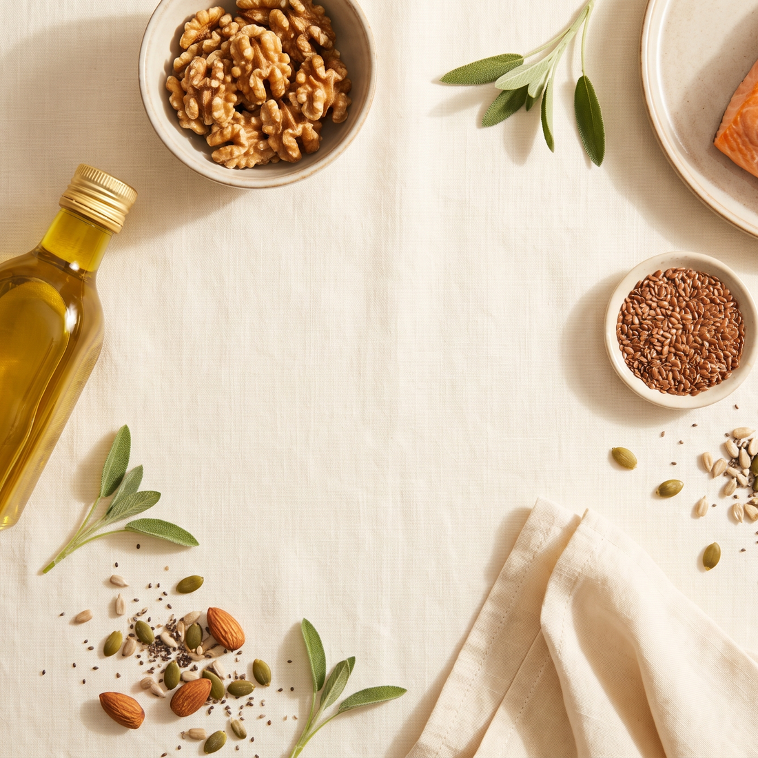 Flatlay met olijfolie, walnoten, zalm en zaden in balans